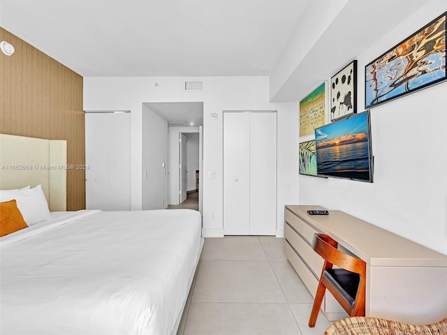 tiled bedroom with a closet