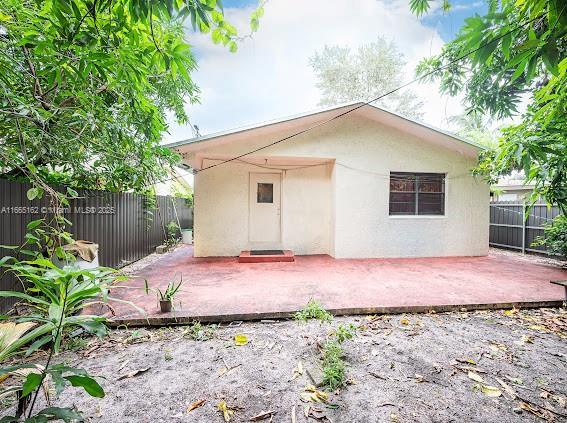 back of property featuring a patio area, a fenced backyard, and stucco siding