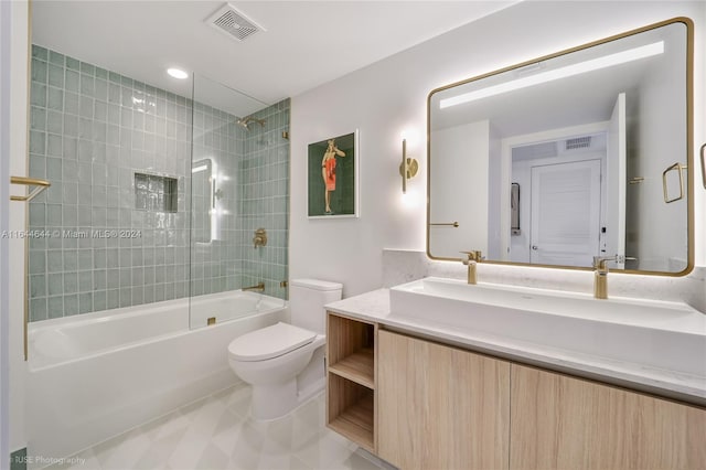 full bathroom featuring vanity, toilet, and tiled shower / bath