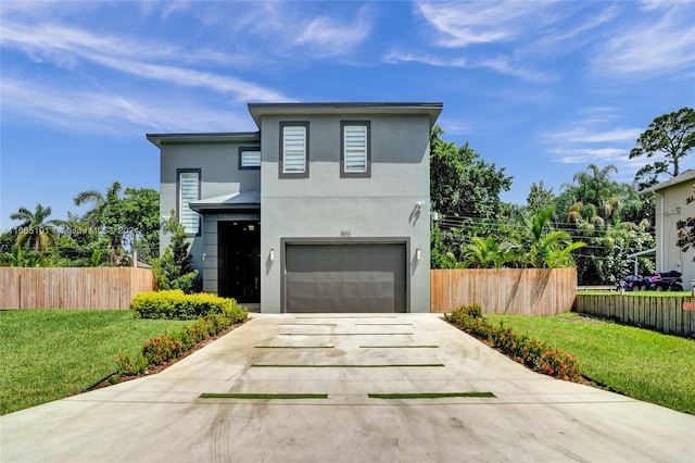 contemporary house with a garage and a front lawn