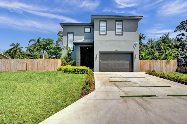 contemporary house with a garage and a front lawn