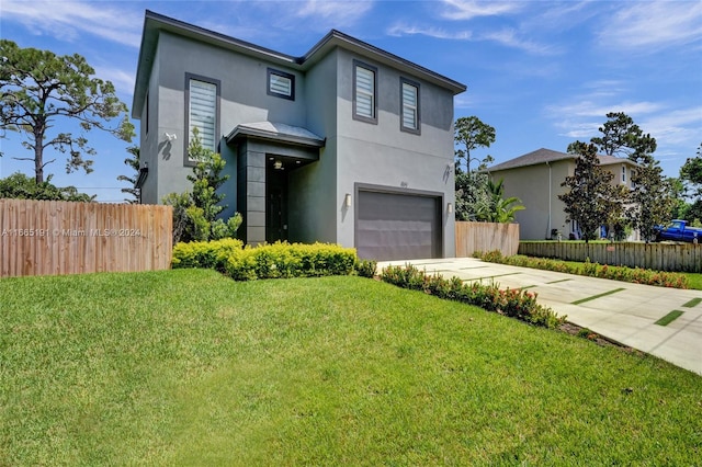 contemporary home featuring a front lawn and a garage