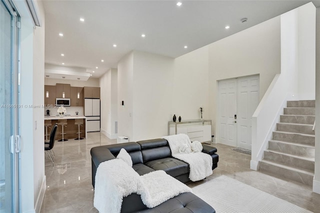 4593 Meadow Green Trl, Lake Worth, FL 33463 - living area featuring light marble finish floors, stairway, recessed lighting, and baseboards