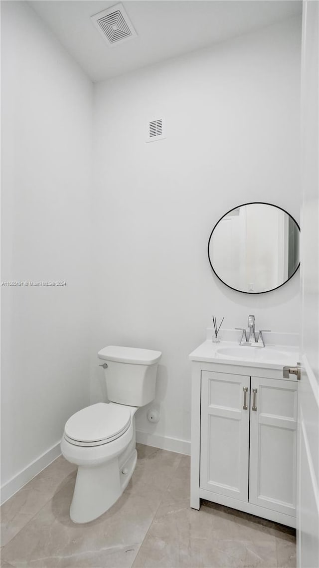 4593 Meadow Green Trl, Lake Worth, FL 33463 - half bathroom with toilet, vanity, and baseboards
