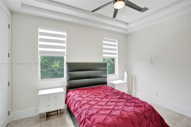 4593 Meadow Green Trl, Lake Worth, FL 33463 - bedroom with a tray ceiling, baseboards, and ceiling fan