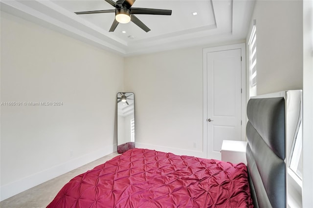 4593 Meadow Green Trl, Lake Worth, FL 33463 - bedroom with a tray ceiling, baseboards, and a ceiling fan