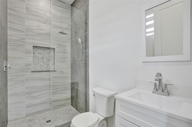 4593 Meadow Green Trl, Lake Worth, FL 33463 - bathroom featuring toilet, a stall shower, and vanity