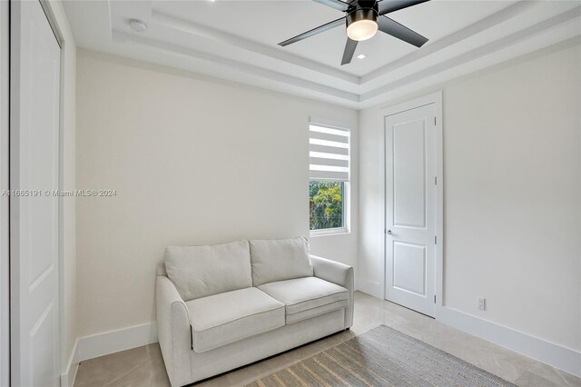 4593 Meadow Green Trl, Lake Worth, FL 33463 - living area with a tray ceiling, ceiling fan, and baseboards