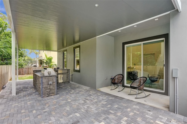 4593 Meadow Green Trl, Lake Worth, FL 33463 - view of patio / terrace with exterior kitchen and fence