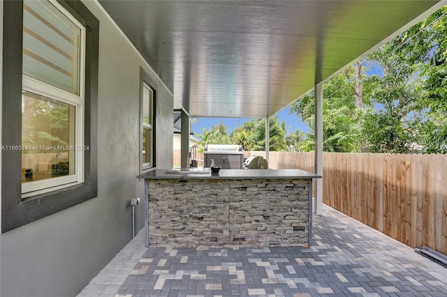 4593 Meadow Green Trl, Lake Worth, FL 33463 - view of patio / terrace with a fenced backyard and exterior kitchen