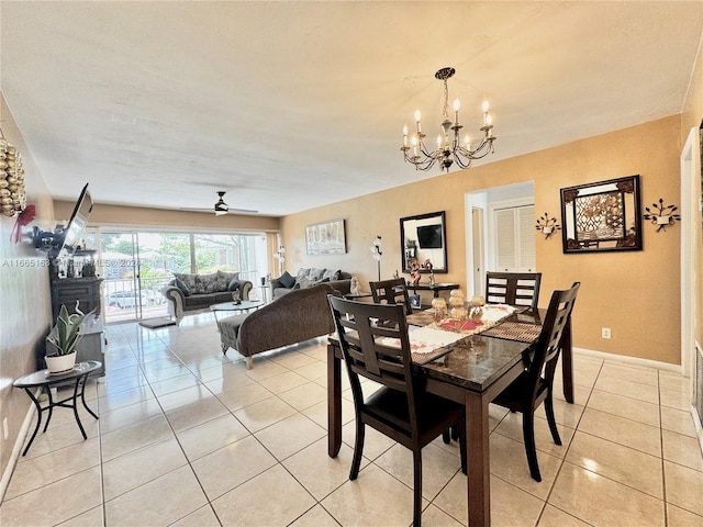 dining area with ceiling fan with notable chandelier and light tile patterned floors