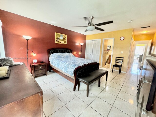 tiled bedroom featuring ceiling fan