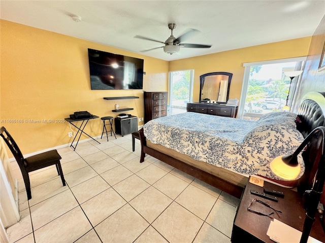 bedroom with tile patterned floors and ceiling fan