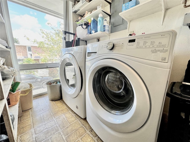 laundry area featuring washing machine and clothes dryer