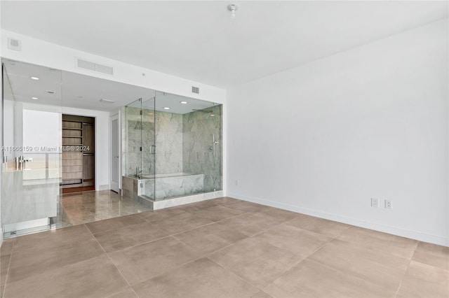 spare room featuring tile patterned flooring