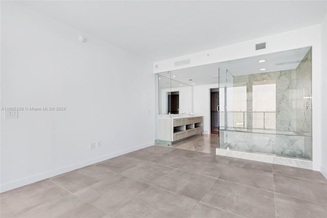 unfurnished living room with light tile patterned floors