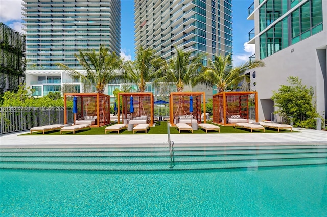 view of swimming pool with a pergola