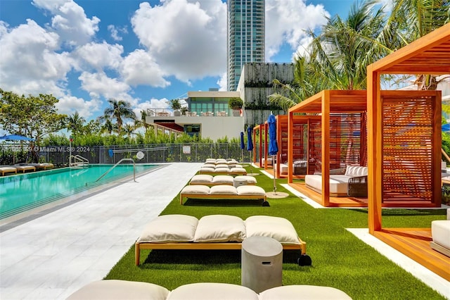 view of swimming pool featuring an outdoor living space and a patio