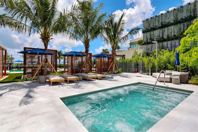 view of swimming pool with a patio