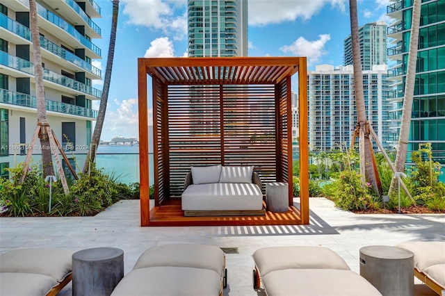 view of patio / terrace featuring a balcony and a water view