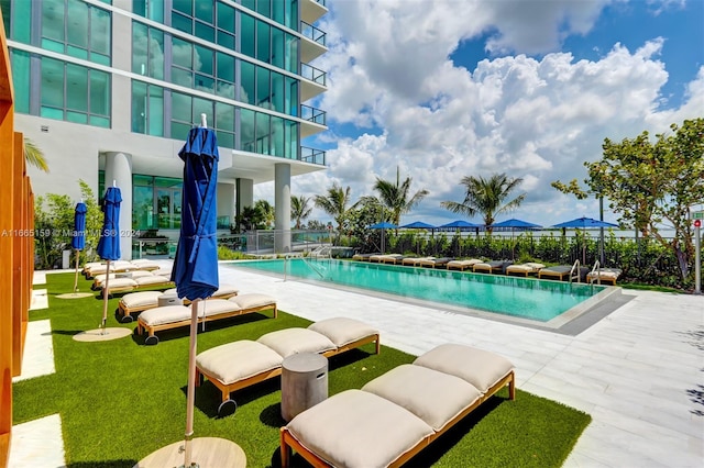 view of pool featuring a patio