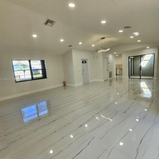 unfurnished living room featuring a textured ceiling