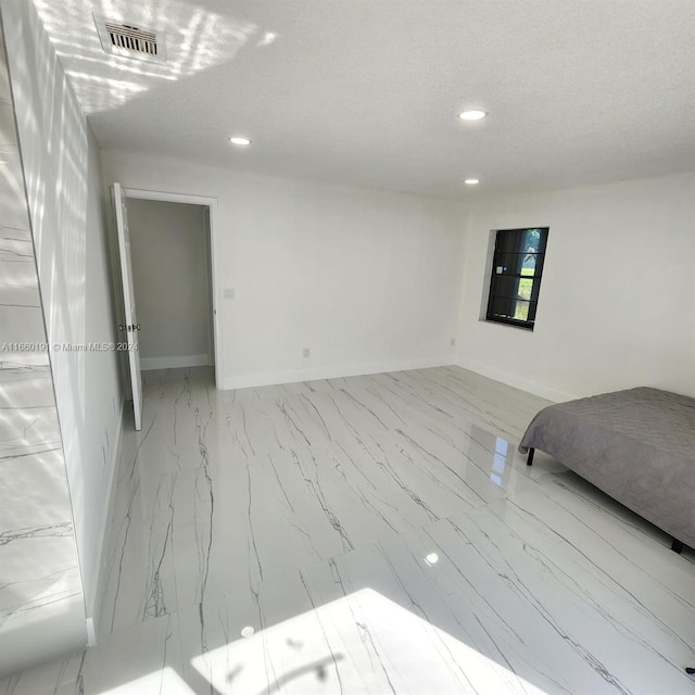 bedroom with a textured ceiling