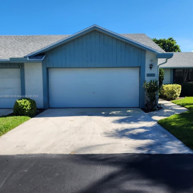 ranch-style house featuring a garage