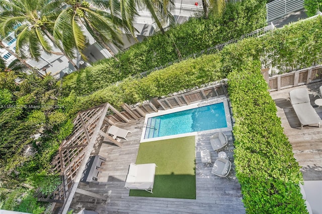 view of pool with a wooden deck