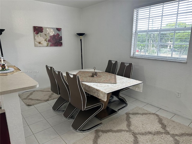 dining space with light tile patterned floors