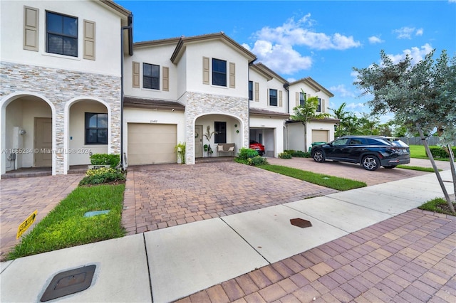 view of front of property with a garage