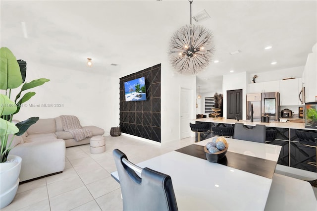 tiled dining room featuring a notable chandelier