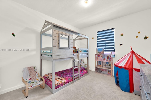 bedroom featuring light carpet