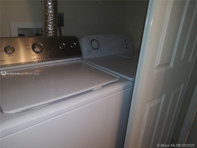 washroom with separate washer and dryer