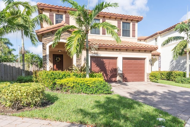 mediterranean / spanish-style home featuring a garage