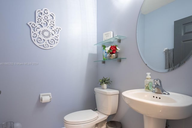 bathroom featuring sink and toilet