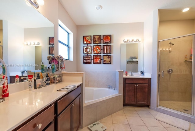 bathroom featuring independent shower and bath, tile patterned flooring, and vanity