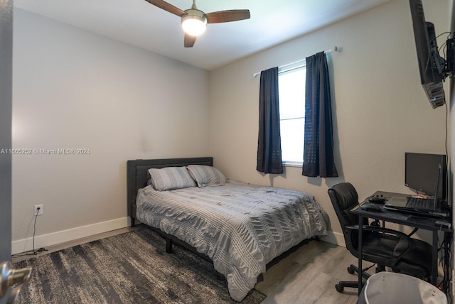 bedroom featuring wood-type flooring and ceiling fan