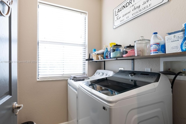 washroom featuring washing machine and dryer