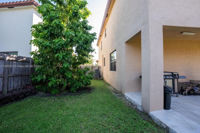 view of yard with a patio area and central AC