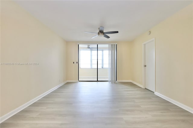 unfurnished room with light hardwood / wood-style flooring and ceiling fan