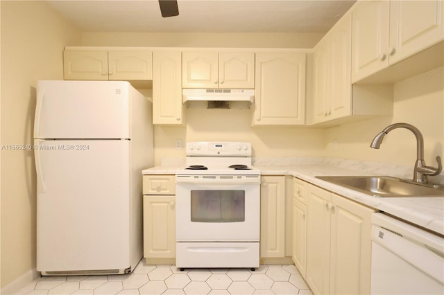 kitchen featuring white cabinets, white appliances, and sink