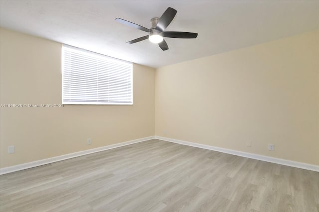 unfurnished room with ceiling fan and light wood-type flooring