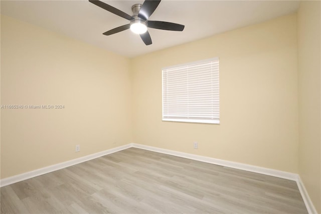 unfurnished room with ceiling fan and light hardwood / wood-style flooring