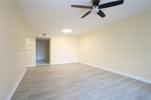 spare room with light hardwood / wood-style floors and ceiling fan