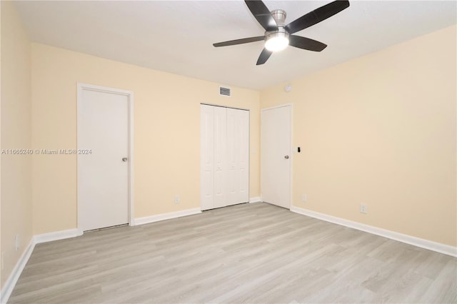 unfurnished bedroom with light hardwood / wood-style floors and ceiling fan