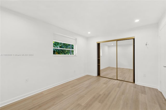 1769 Wa Kee Na Dr, Miami, FL 33133 - unfurnished bedroom with recessed lighting, light wood-type flooring, a closet, and baseboards
