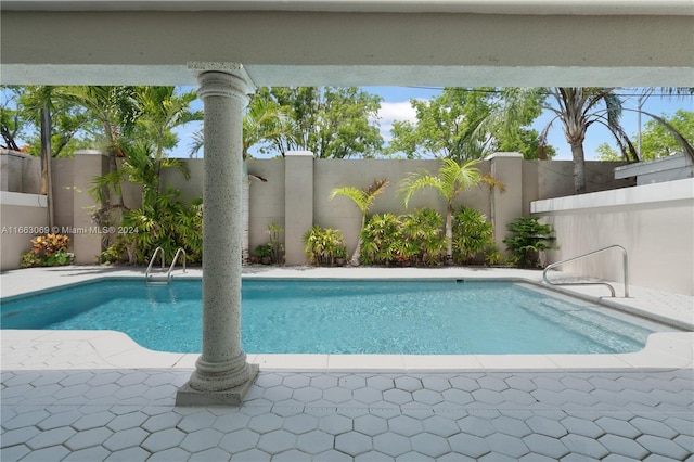 view of swimming pool with a patio area