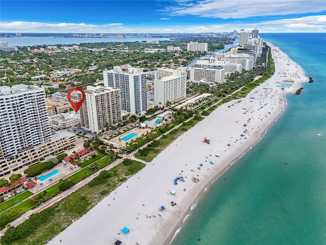 bird's eye view with a view of the beach and a water view