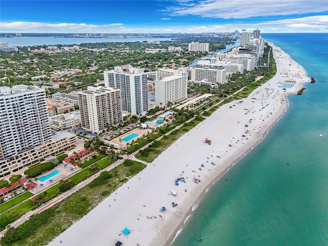 2615 Collins Ave Unit 21, Miami Beach, FL 33140 - drone / aerial view featuring a water view, a view of city, and a beach view